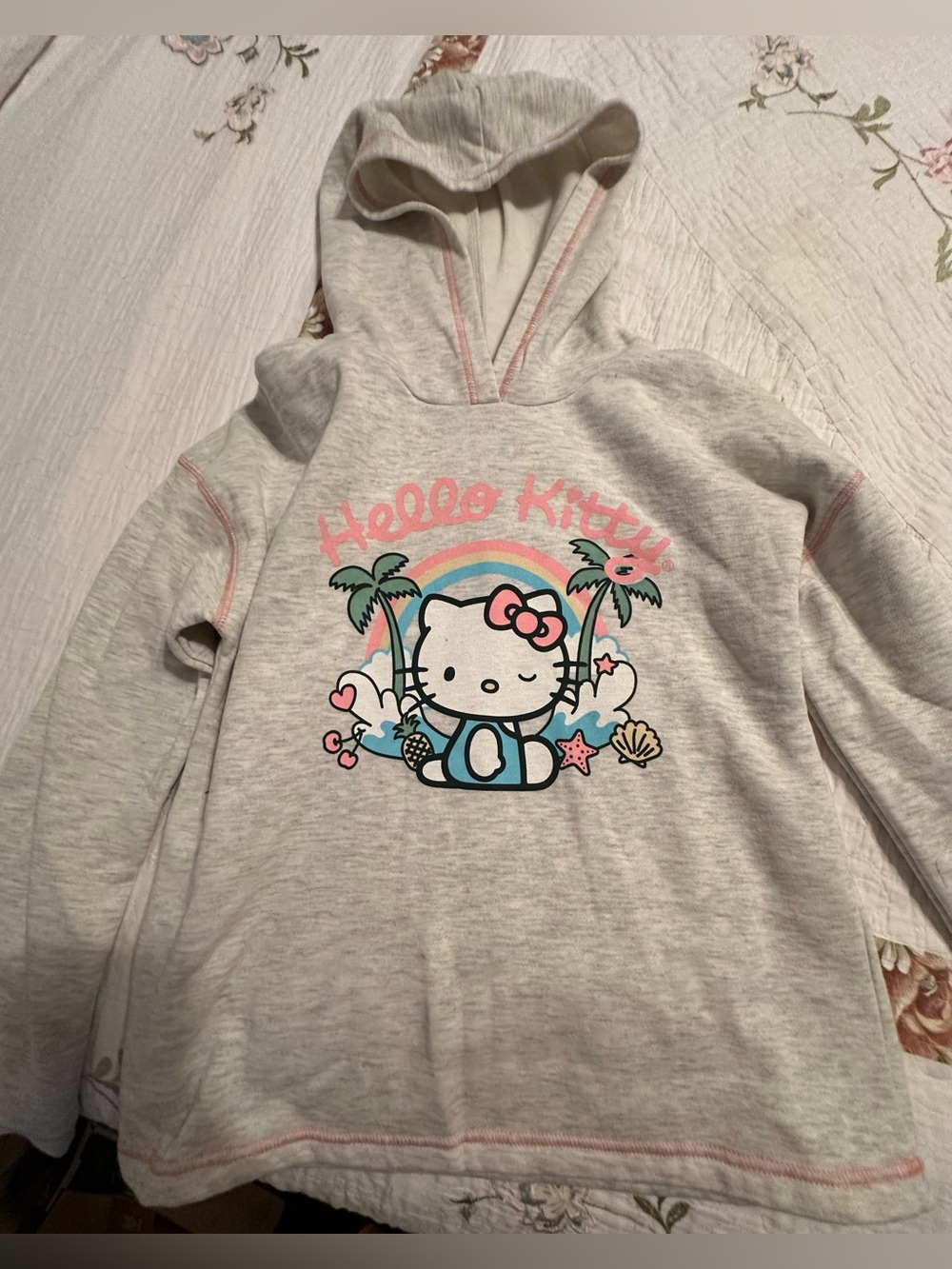 Sanrio Hello Kitty Cream Hoodie with Pastel Beach Graphic